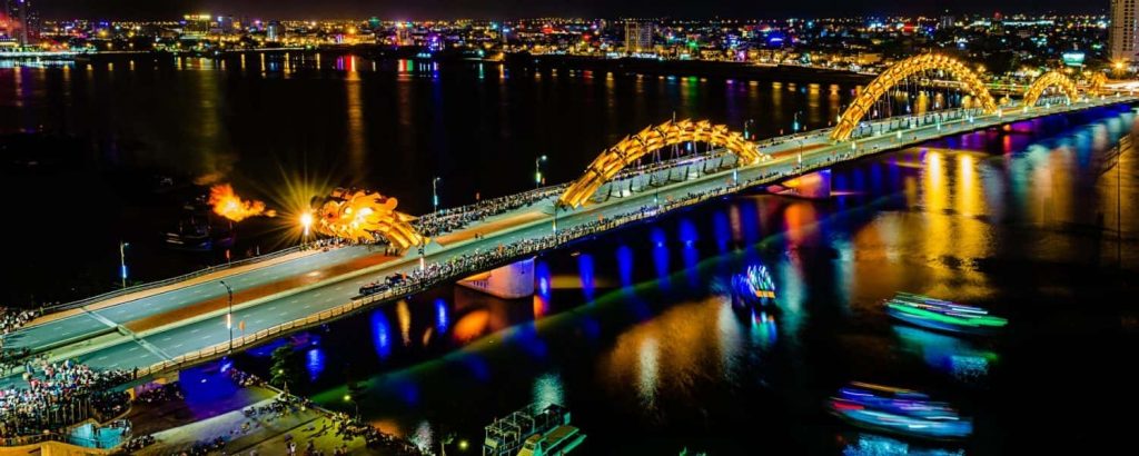 Dragon bridgeThis 2,185-foot-long bridge shaped like an undulating golden dragon is the most famous bridge over the Han River in downtown Danang. On weekend nights, the dragon comes to life in quite an unusual way: the bridge is closed to traffic, and the massive dragon head on the east end of the bridge releases bursts of flames and water in a spectacular night show.
